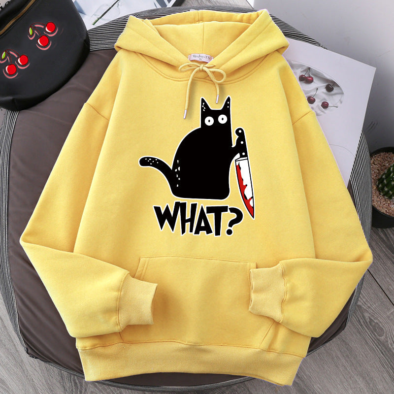 loose fit black cat pullover in yellow with graphic design of a black cat holding a knife and the text 'WHAT?'