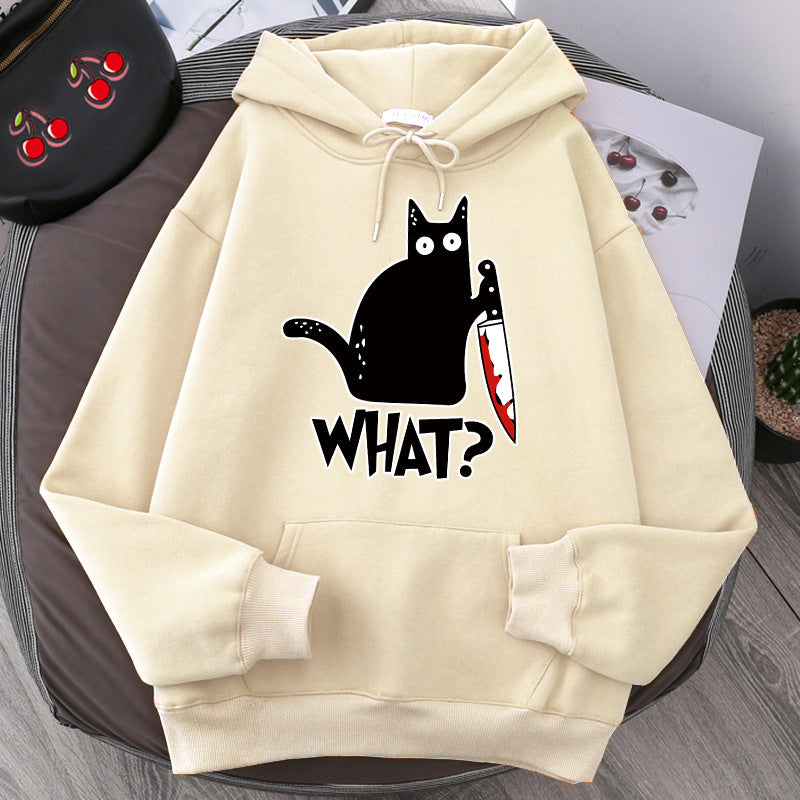 loose fit black cat pullover featuring a playful black cat graphic holding a knife on a khaki background.